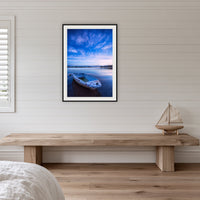Little Dinghy on Merimbula Lake framed print in black with a white mat, in a coastal bedroom
