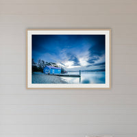 Mitchies Jetty at Dusk, Smooth Lake framed print in oak with a white mat, in a coastal room