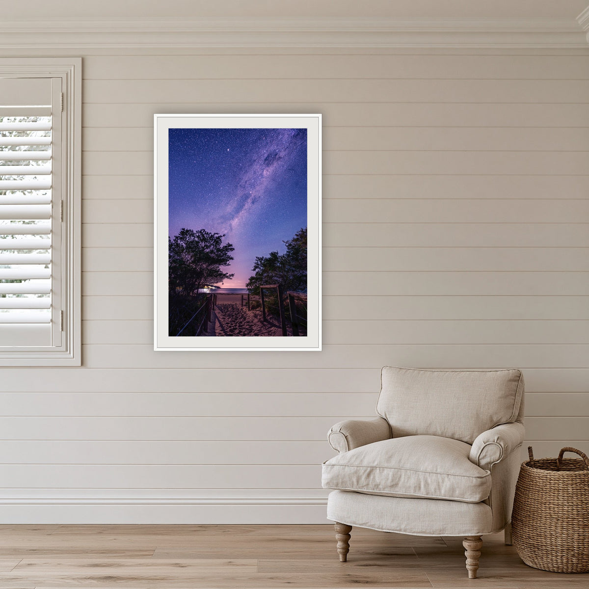 Main Beach Milky Way framed print in white with a mat, in a coastal lounge room