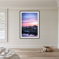 Eden Showtime framed print in black with a white mat, in a coastal bedroom