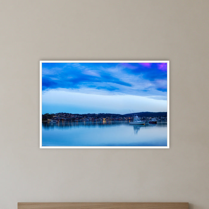 Dawn over Merimbula Lake in a white frame without a mat, on a bedroom wall