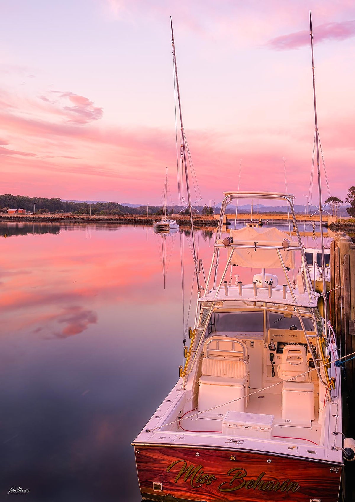 Miss Behavin boat print, pink and gold sunrise at Merimbula Marina