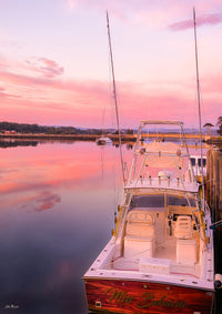 Miss Behavin boat print, pink and gold sunrise at Merimbula Marina