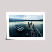 Weathered dinghy at Fishpen jetty, Merimbula Lake NSW — artistic treatment — framed print