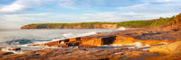 Short Point Merimbula dawn panorama, rocky foreshore and golden light