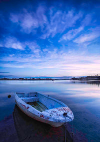 Little dinghy moored on Merimbula Lake at violet sunset, NSW Sapphire Coast — canvas print