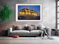 Tathra Hotel wall art — restored heritage hotel under vivid orange sunset sky, Tathra NSW
