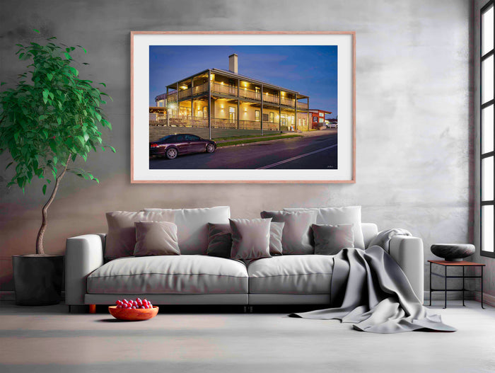 Tathra Hotel wall art — restored heritage hotel under vivid orange sunset sky, Tathra NSW