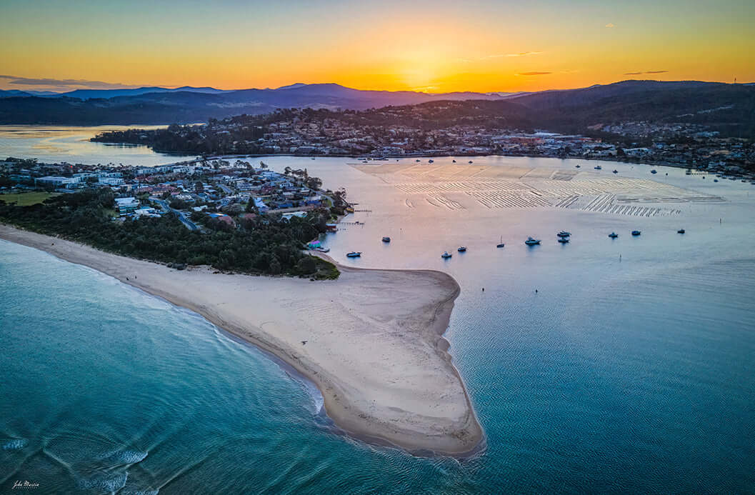 Fishpen aerial photograph at sunset, Merimbula Lake and township from above