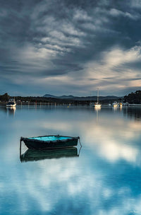 Little Boat Merimbula Lake print, moored dinghy at sunset
