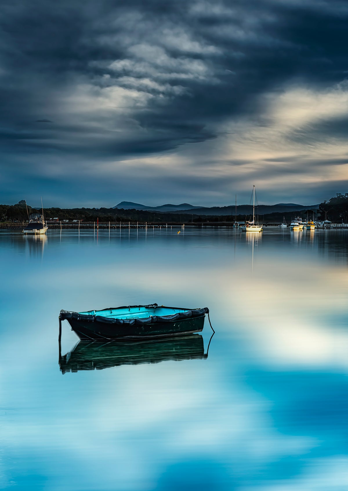 Moored dinghy on Merimbula Lake at dusk, NSW — artistic long-exposure treatment — canvas print
