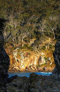 Pambula Beach rock frame print, natural archway with golden cliff beyond