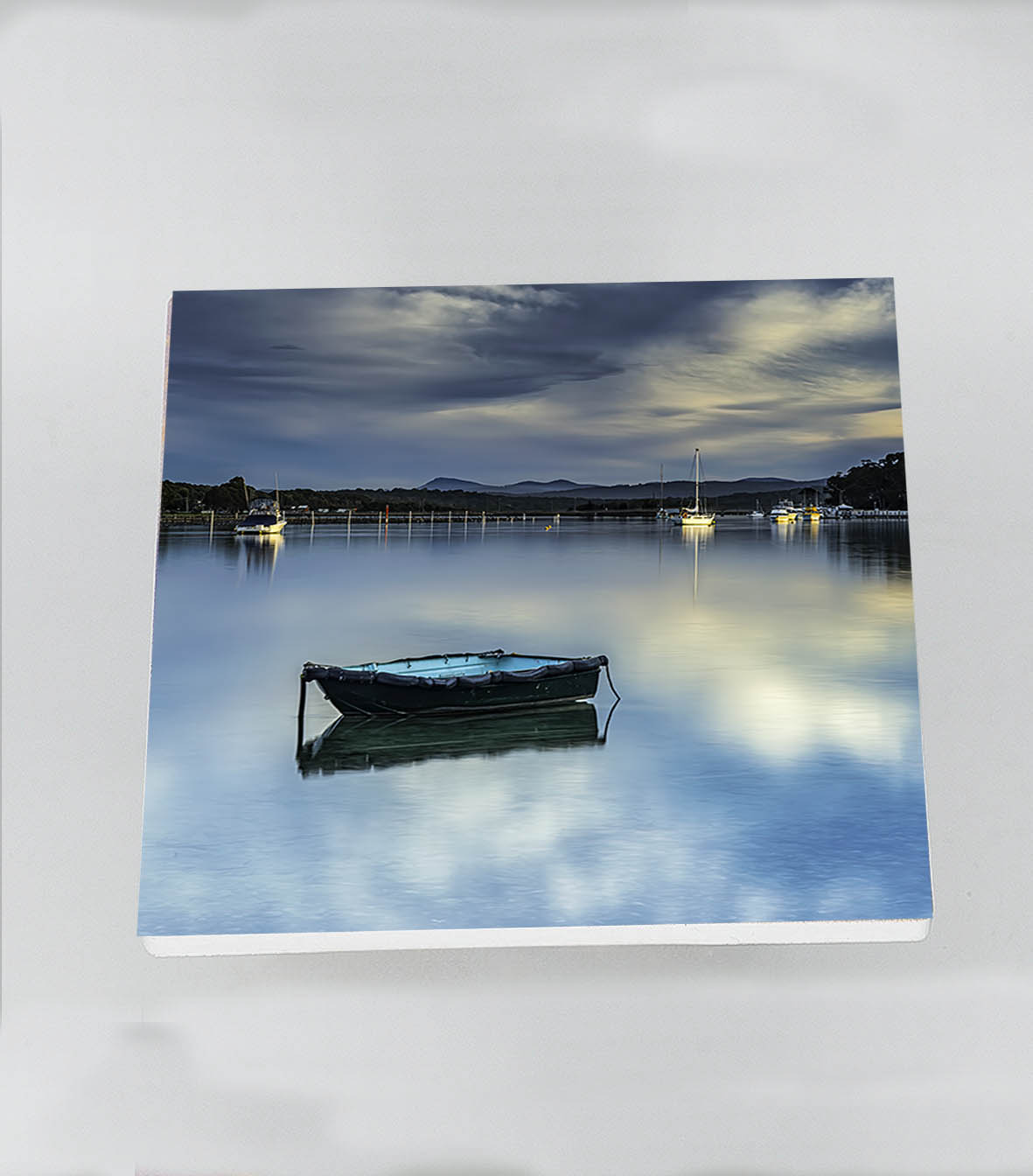 Single square ceramic coaster — Little Boat on Merimbula Lake at sunset, NSW Sapphire Coast