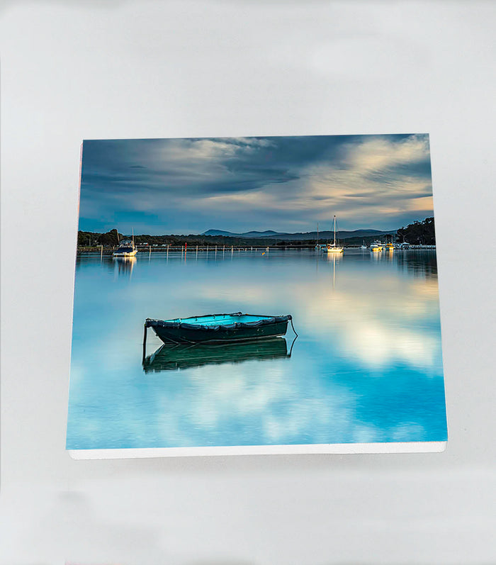 Single square ceramic coaster — Little Boat on Merimbula Lake at sunset, NSW Sapphire Coast