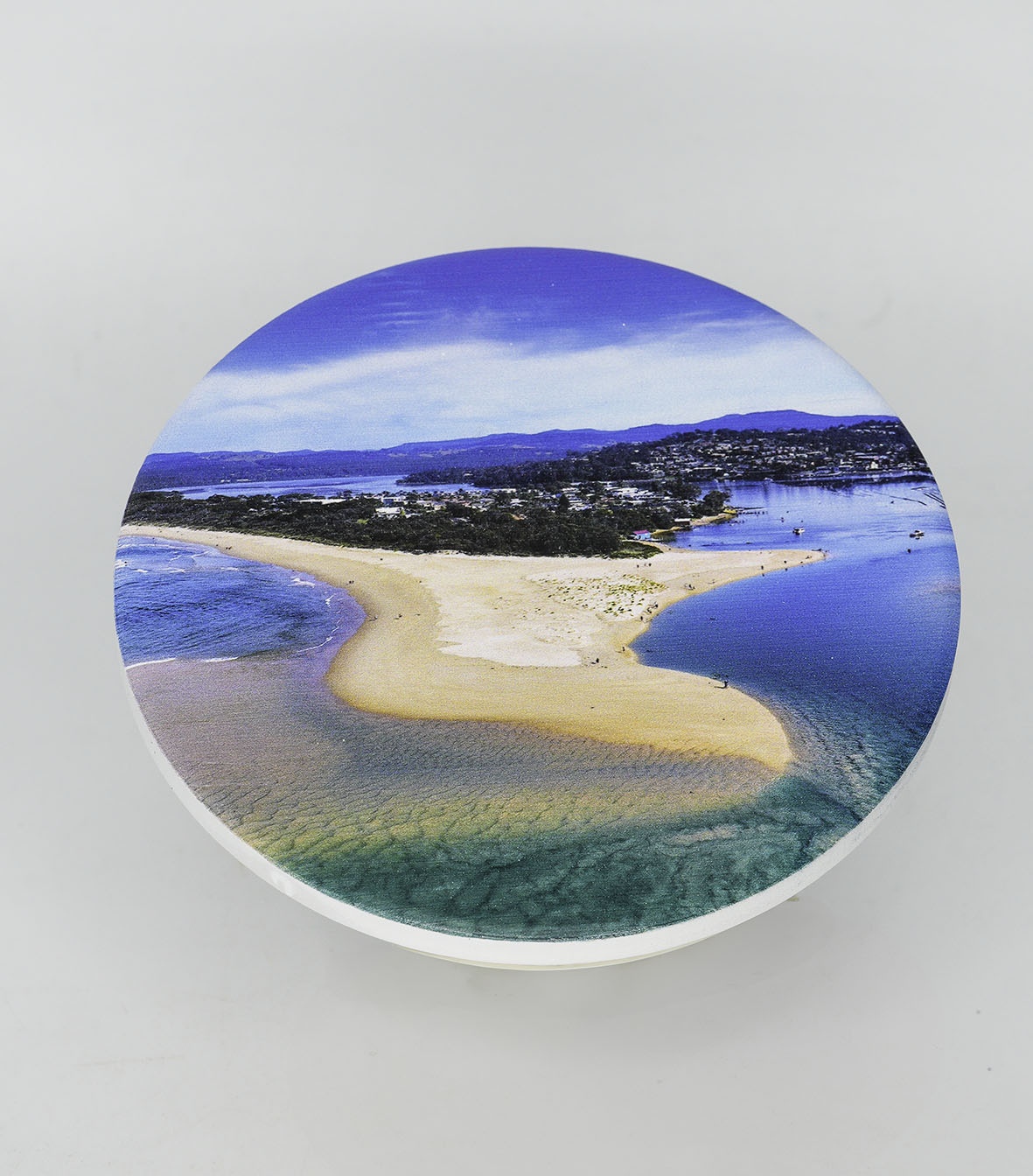 Single round ceramic coaster — Merimbula Lake and Fishpen aerial, NSW Sapphire Coast