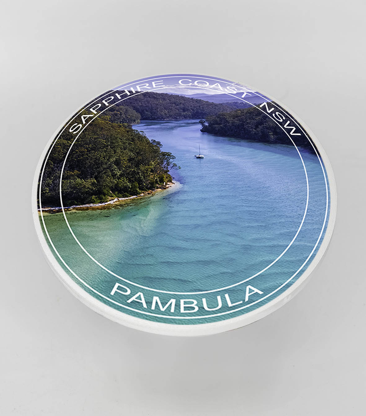 Single round ceramic coaster with text — Pambula River NSW